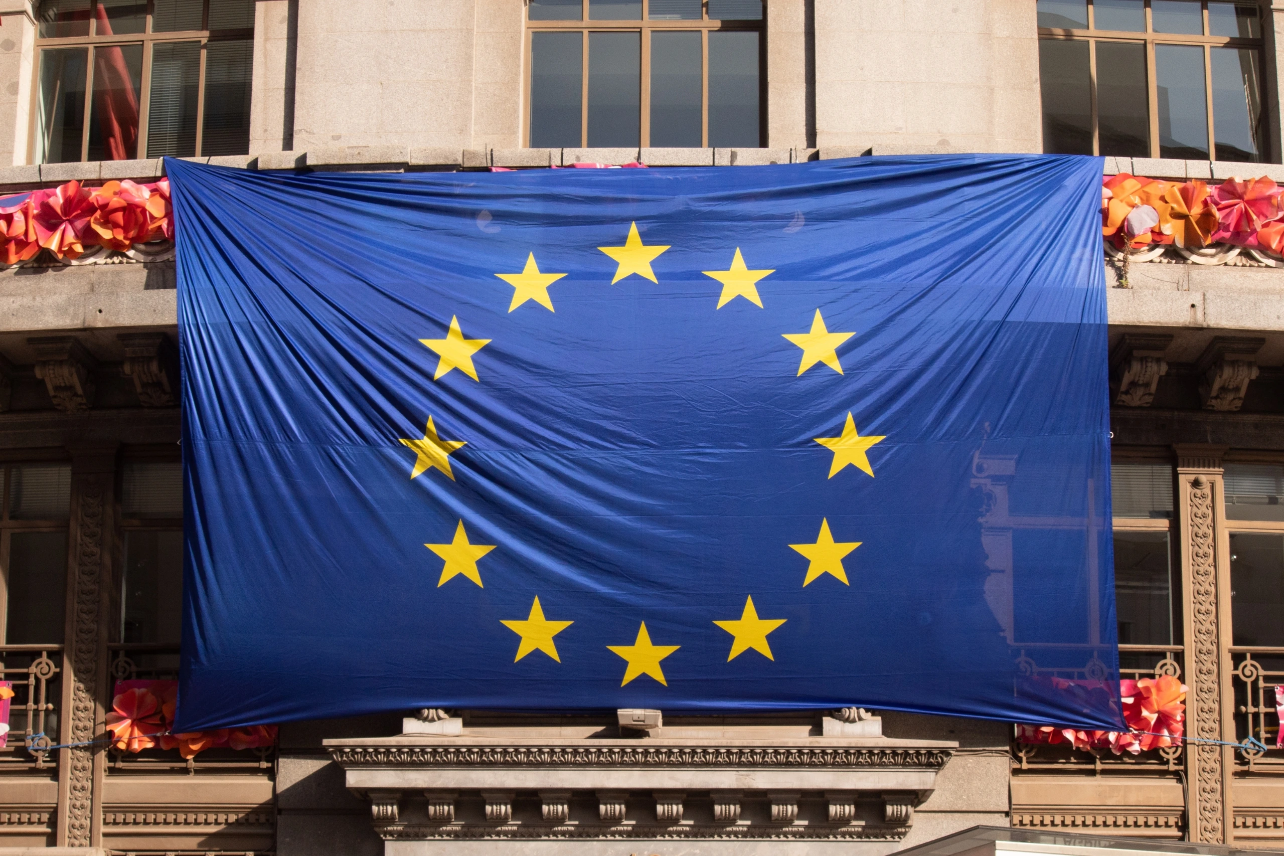 European Union flag displayed on a building facade