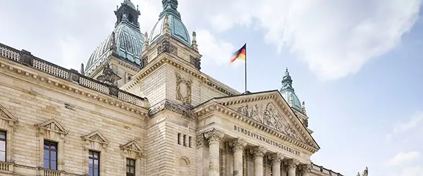 Classical style building facade with German flag