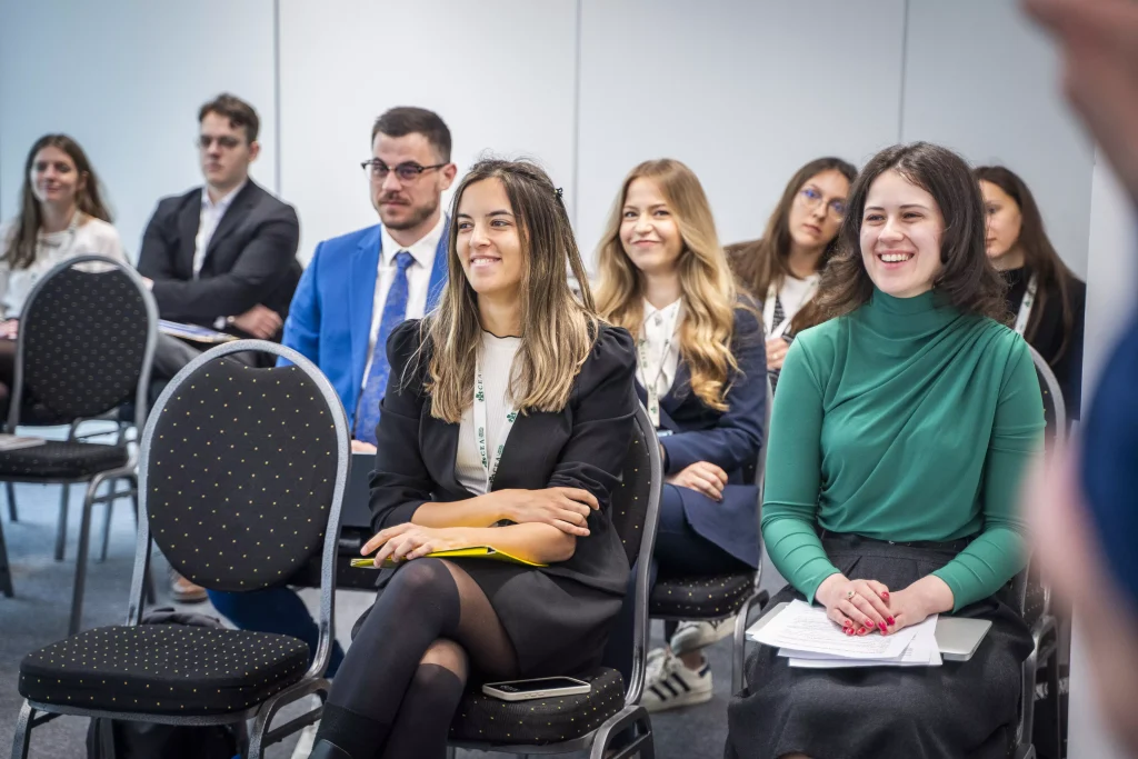 Audience members listening attentively