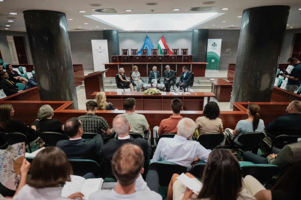 Conference hall with a presentation and audience