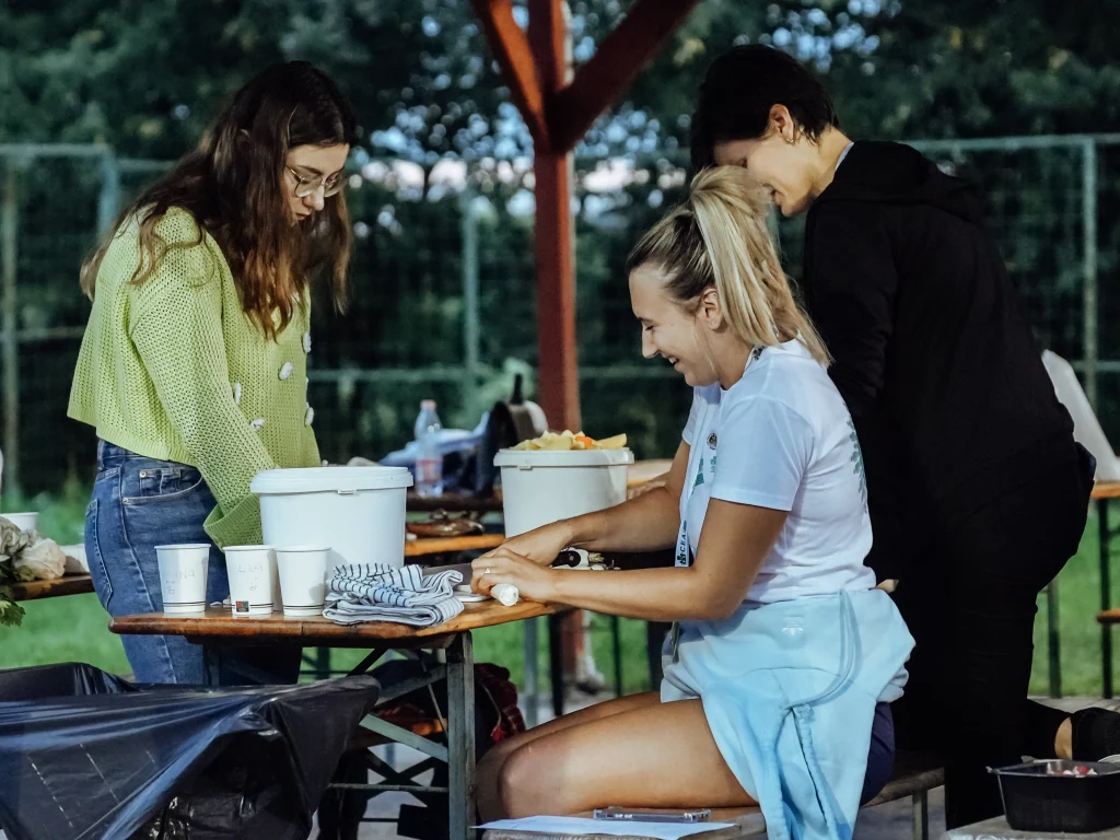 Participants cook outdoors