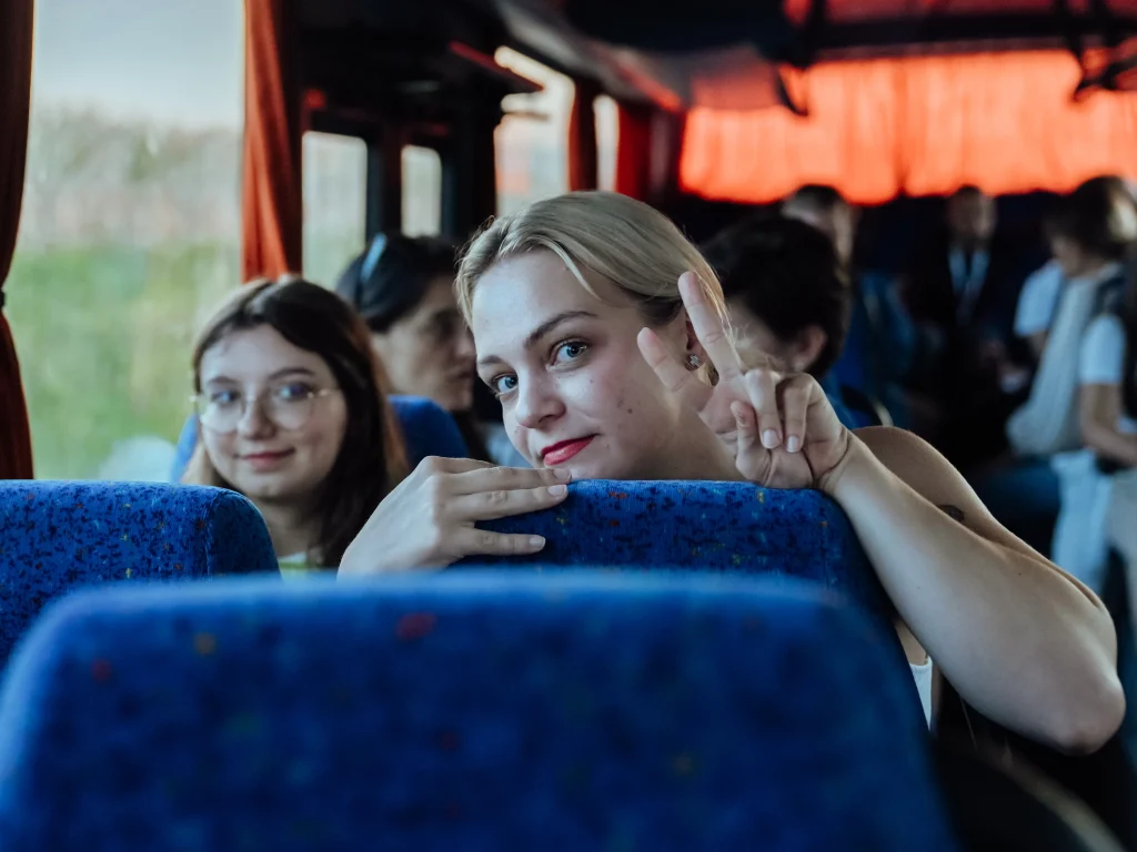 Woman and girl talking on a bus