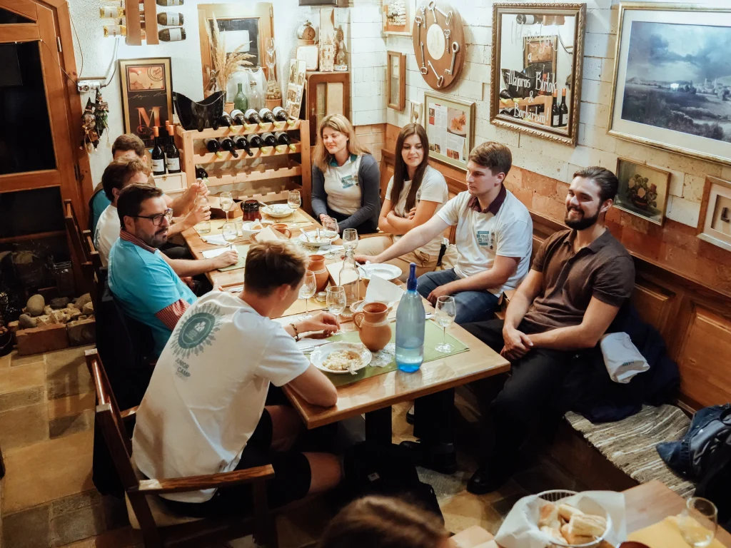 Participants having dinner in a restaurant